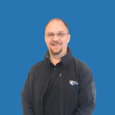 Man in blue jacket smiling